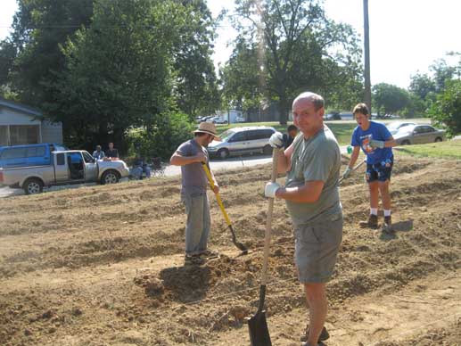 Dr. Bob (front) takes time out for a photo, while Jacob Holloway and Matthew Kelly catch up on digging.